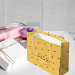 Bridal shower cute happy bumble bees monogram large gift bag<br><div class="desc">Decorated with happy, smiling yellow and black bumble bees. A yellow background. Personalise and add a name. The name is written with a large modern hand lettered style script with swashes. To keep the swashes only delete the sample name, leave the spaces or emoji's in front and after the name....</div>