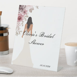 bridal shower sign with pretty flowers and a bride