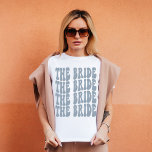 Bride Dusty Blue Customised Matching Bridal Party T-Shirt<br><div class="desc">Are you looking for a unique and fun way to celebrate your bachelorette party? Why not go with a personalised t-shirt theme? With our retro The Bride personalised dusty blue t-shirt, you can have all of your bridal party matched up in style! Not only will this shirt be a great...</div>