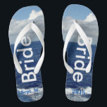 Bride Ocean Waves Blue Sky Thongs<br><div class="desc">One-of-a-kind Bride flip flops custom designed. Pretty Blue Sky with Fluffy White Clouds, Blue Sea and White Foam Ocean Waves. Unisex Flip Flops with Bride written in a light silver text, and Date of Marriage in blue text. PERSONALIZE with your Wedding DATE (or delete text). Shown with Wide White Straps...</div>