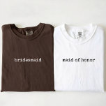 Bride Squad | Modern Minimalist Script Bridesmaid T-Shirt<br><div class="desc">Celebrate your special day in style with this Personalised Bridesmaid T-Shirt, designed with a simple, stylish script and elegant calligraphy for a timeless minimalist look. This custom shirt is perfect for bridesmaids, the bride, and the entire wedding party, making it ideal for bachelorette parties, bridal showers, bridesmaid proposal gifts, and...</div>