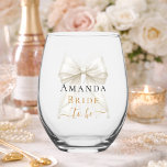 Bride to be ivory bow pearls elegant Bachelorette Stemless Wine Glass<br><div class="desc">Celebrate in style with this elegant bachelorette party wine glass. The design features a delicate ivory,  cream colored bow accented with pearls and sophisticated gold-toned typography. It makes a perfect commemorative gift for the bride-to-be to use during her bridal shower or girls' night out.</div>