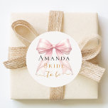 Bride to be pink bow pearls elegant Bachelorette Classic Round Sticker<br><div class="desc">Celebrate in style with this elegant bachelorette party wine glass. The design features a delicate blush pink bow accented with pearls and sophisticated gold-toned typography. It makes a perfect commemorative gift for the bride-to-be to use during her bridal shower or girls' night out.</div>