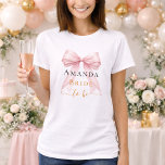 Bride to be pink bow pearls elegant Bachelorette T-Shirt<br><div class="desc">Elevate your bridal events with this sophisticated coquette-themed party collection. Each piece showcases a high-fidelity pink bow paired with delicate pearl accents and timeless typography. This set is perfect for the modern bride wanting a cohesive look for her bachelorette trip and bridal shower.</div>