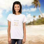 Bride tribe bachelorette party script black gold T-Shirt<br><div class="desc">For a bridal shower or a bachelorette spa and wellness weekend. A chic white background. Personalise and add the name of the bride. Black and golden letters. With the text: Bride tribe.  The word tribe is written with a modern hand lettered style script with swashes.</div>