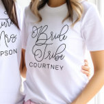 Bride Tribe Black Modern Script Custom Wedding T-Shirt<br><div class="desc">Modern and casual chic black calligraphy script "Bride Tribe" women's wedding tee shirt features custom text that can be personalised for your bridal party crew. Perfect for your bridesmaids to wear at the bachelorette party and the wedding weekend!</div>
