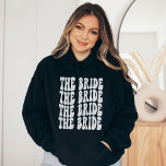 Bride White Customised Matching Bridal Party Hoodie<br><div class="desc">Are you looking for a unique and personalised bachelorette party outfit? Look no further than the white text Bride hoodie. This sweatshirt is perfect for your group of girlfriends. It features a fun and colourful design that will match any theme you choose for your bachelorette party. Plus, it's made from...</div>