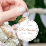 Bridesmaid Coral & Silver Lace White Wedding Gift Key Ring<br><div class="desc">These keychains are designed to give as favours to bridesmaids in your wedding party. They feature a simple yet elegant design with a white background, terracotta or coral orange and grey text, and a silver faux foil floral lace border. There is space for her name, the names of the couple,...</div>