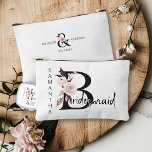 Bridesmaid Flower Letter Boho Floral Personalised Accessory Pouch<br><div class="desc">Bridesmaid accessory bag to personalise for your bridesmaid. Bridesmaid is lettered with neutral boho floral letters and handwritten script. You can also add the name of the bride and groom and their wedding date, which frames a co-ordinating floral ampersand. Lovely wedding party keepsake gift and perfect for a fall wedding,...</div>