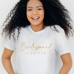 Bridesmaid Gold Custom Name Bachelorette T-Shirt<br><div class="desc">The Bridesmaid Gold Custom Name Bachelorette T-Shirt is a modern and minimalist statement piece for your bridal party. Featuring a sleek faux gold script, this simple yet stylish shirt is perfect for bachelorette festivities and can be customised with each bridesmaid's name. It’s a chic and practical wedding party gift that...</div>