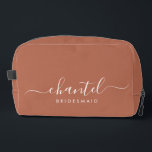 Bridesmaid Modern Script Cosmetic Terracotta Dopp Kit<br><div class="desc">This Bridesmaid accessory bag features a handwritten white script typography with swashes on a terracotta background. Present your bridesmaids with a toiletry bag for their makeup and small items traditionally presented at the rehearsal dinner,  for use in the early morning before the wedding.</div>