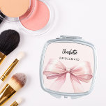 Bridesmaid pink bow elegant compact mirror<br><div class="desc">A pink bow and background.  Personalise and add your bridesmaid's name.   Black handwritten style script.</div>