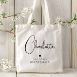 Bridesmaid Wedding Simple Modern Script Name Tote Bag<br><div class="desc">Bridesmaid Wedding Simple Modern Calligraphy Script Personalised Name Tote Bags features your bridesmaid's name in elegant black calligraphy script accented with a simple love heart with the addition of your custom text such as the date and bridemaid. Text and heart colours can be adjusted in the editor to suit your...</div>