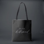 Bridesmaid's Gift Wedding Party Modern Minimalist Tote Bag<br><div class="desc">Elevate the art of gifting with our Personalised Bridesmaid Tote Bag – a timeless expression of appreciation and a symbol of cherished moments. Crafted with simplicity and elegance, this tote bag boasts modern romantic calligraphy that spells out "Bridesmaid" in exquisite white script, tailored to perfection. Black and white converge in...</div>