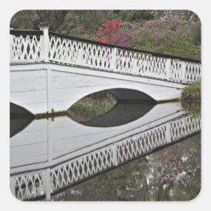 Bridge reflecting on pond, Magnolia Square Sticker