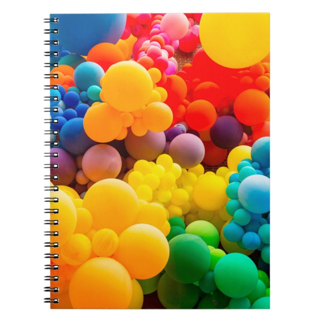 Bright abstract background of jumble of rainbow co notebook (Front)