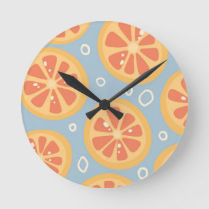 Bright and Bold Orange Slices Pattern on Blue Round Clock