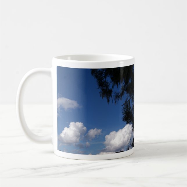 Bright blue sky and a few white clouds coffee mug (Left)