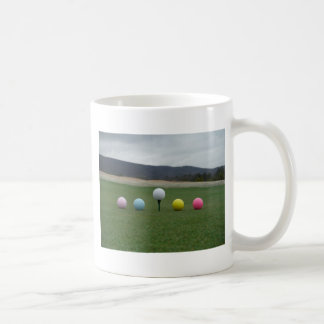 bright coloured Golf Balls on a mountain Coffee Mug