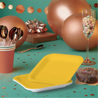 Bright golden-yellow background with subtle paper plate