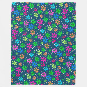 Bright multi-coloured chamomile flowers on a blue  fleece blanket