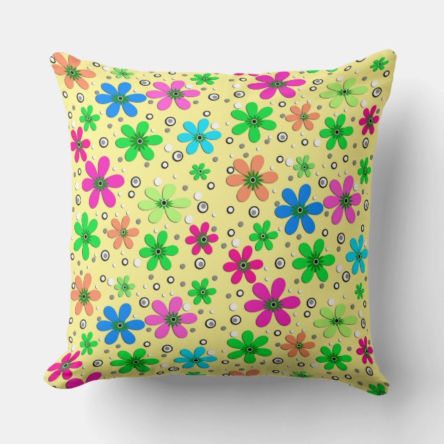 Bright multi-coloured chamomile flowers on a yello cushion (Front)