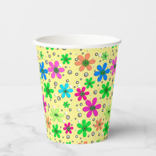 Bright multi-coloured chamomile flowers on a yello paper cups