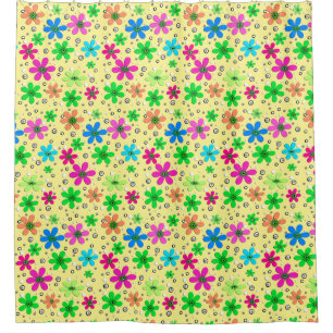 Bright multi-coloured chamomile flowers on a yello shower curtain