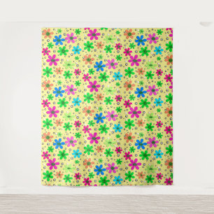 Bright multi-coloured chamomile flowers on a yello tapestry