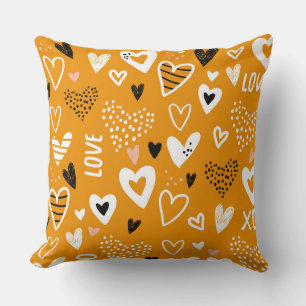 Bright orange and black hearts and love cushion