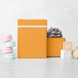 bright orange sheet unrolled at the top and flat wrapping paper