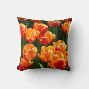 Bright orange tulips in the park cushion