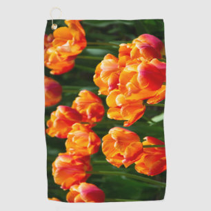 Bright orange tulips in the park golf towel