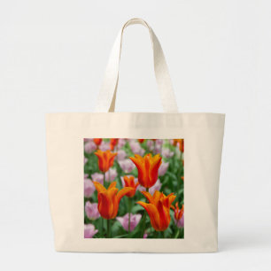 Bright orange tulips in the park    large tote bag
