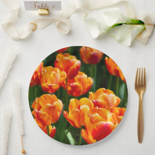 Bright orange tulips in the park paper plate