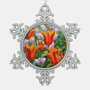 Bright orange tulips in the park snowflake pewter christmas ornament