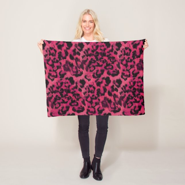 Bright pink and black spotted leopard fleece blanket (In Situ)