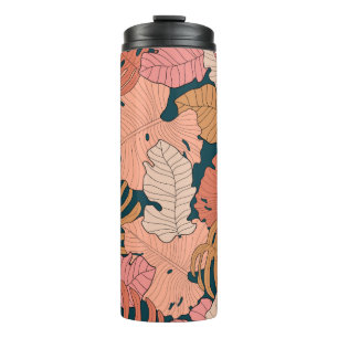 Bright pink, orange, yellow leaves of monstera and thermal tumbler