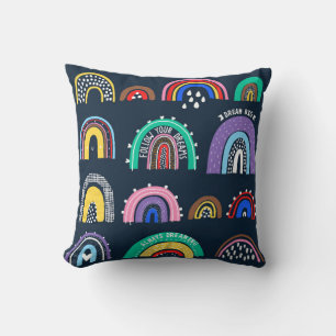 Bright rainbows on a dark background. Cute illustr Cushion