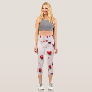 Bright red fruits on white canvas capri leggings