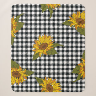 Bright sunflowers on a black and white buffalo che sherpa blanket