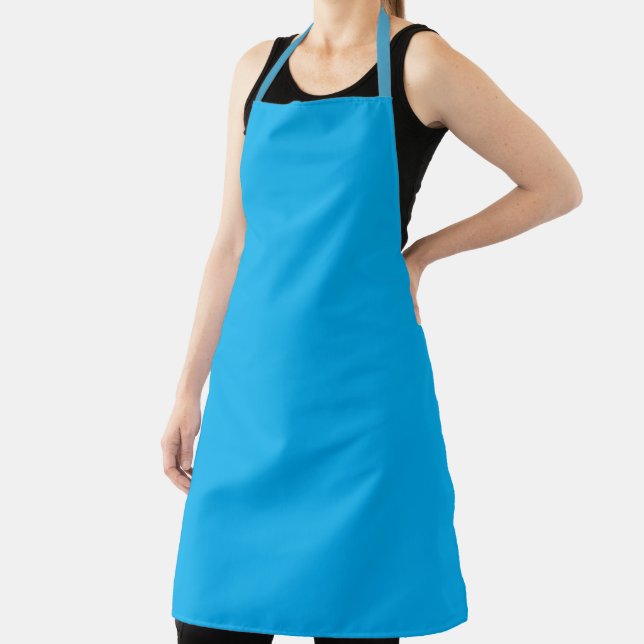 bright turquoise-blue apron with a simple (Insitu)