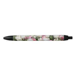Bright white and pink tulips on a sunny black ink pen