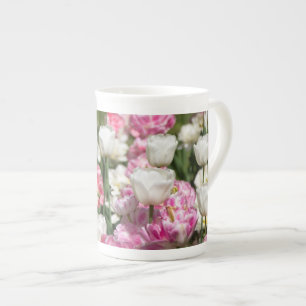 Bright white and pink tulips on a sunny bone china mug