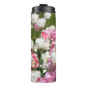 Bright white and pink tulips on a sunny thermal tumbler