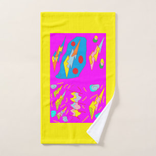 Bright yellow hand towel purple design on it