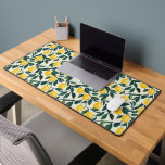 Bright Yellow Lemon Patterned Desk Mat<br><div class="desc">This vibrant design features juicy yellow lemons nestled among lush dark green leaves, creating a refreshing and cheerful look. Set against a subtle, neutral background, the hand-painted style adds a rustic charm while highlighting the natural beauty of citrus fruits. Perfect for those who love bold, botanical designs and a touch...</div>