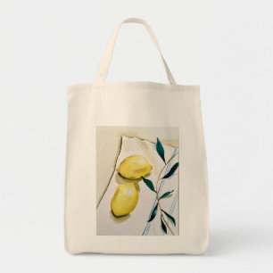 bright yellow lemons with herbs for cooking tote bag