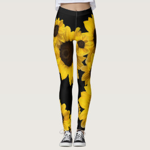 Bright yellow sunflowers on black background leggings