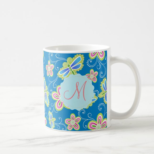 Brillant flowers, dragonflies and swirls on blue coffee mug (Right)